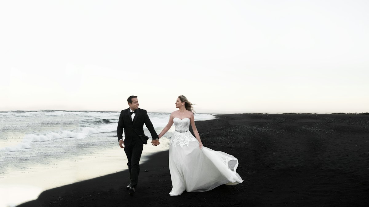A couple walking along a beach